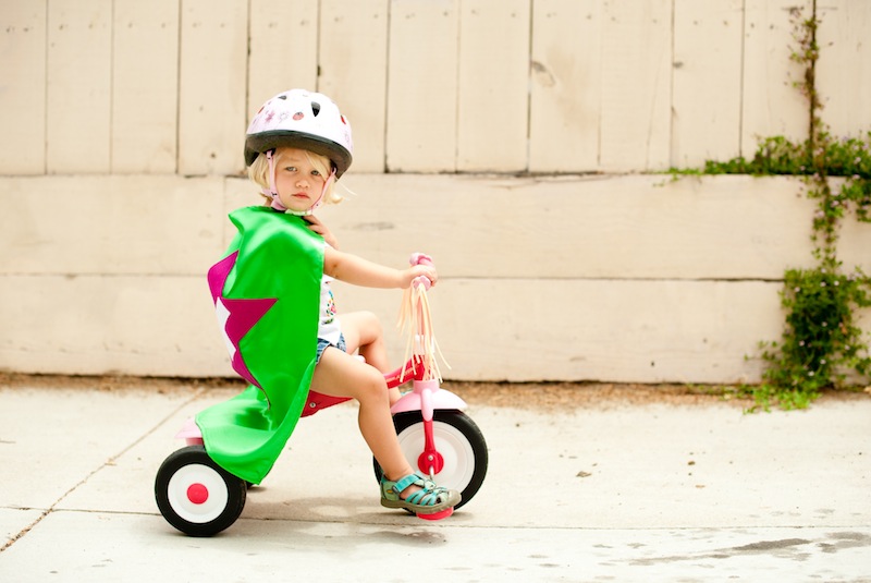 Caped Kid on a Bike